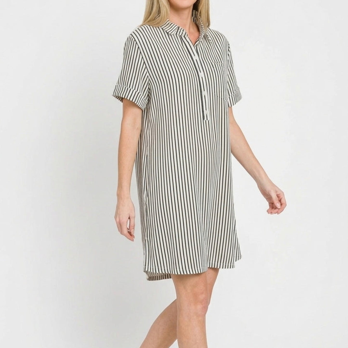 Lifestyle view of the Black striped collared dress styled for a chic, casual coastal look.