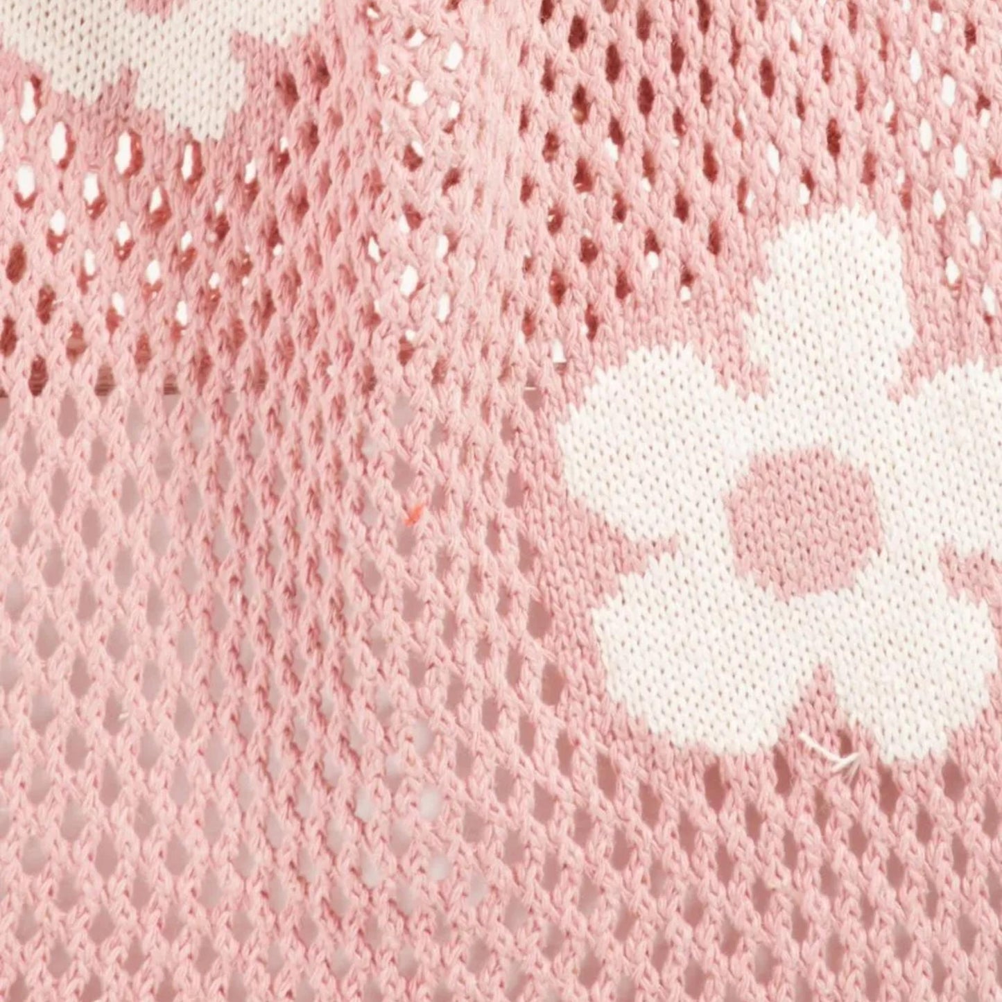 Close up view of the Fame Flower knitted shoulder bag showcasing the comfortable strap and spacious design.