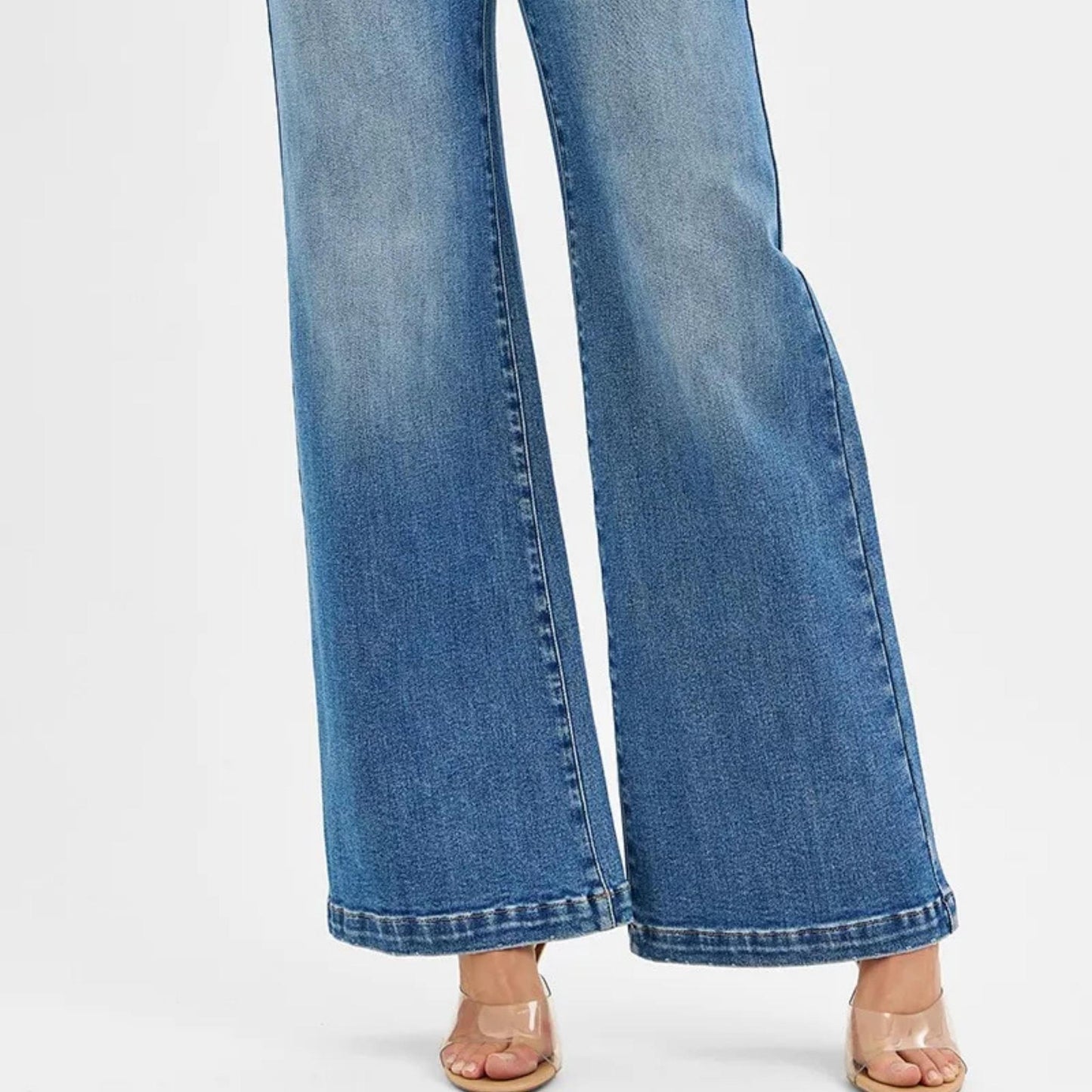 RISEN high-rise wide-leg jeans with front yoke detail styled with a long-sleeve top.