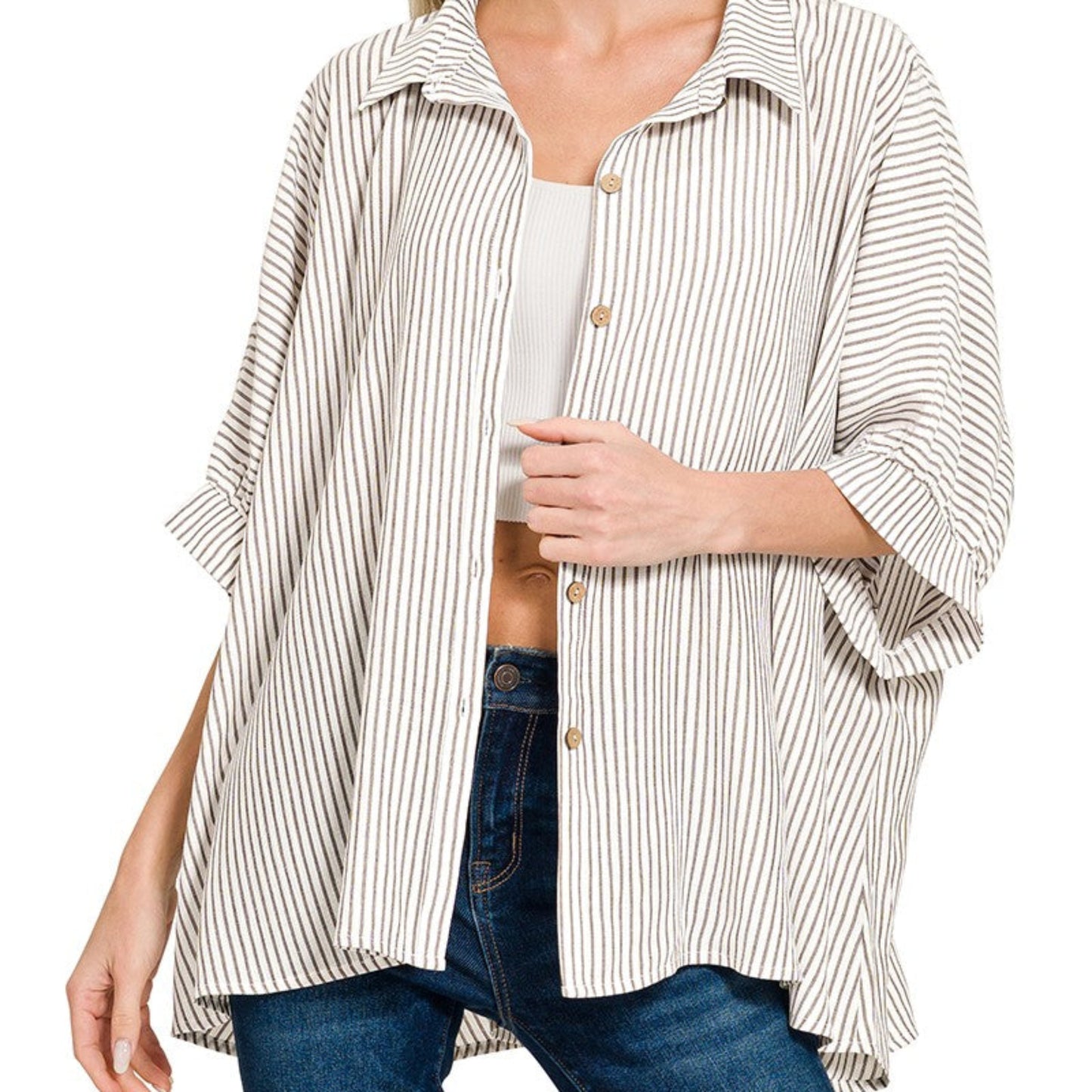 Front view of the warm brown striped boxy shirt showing the functional button-down front.