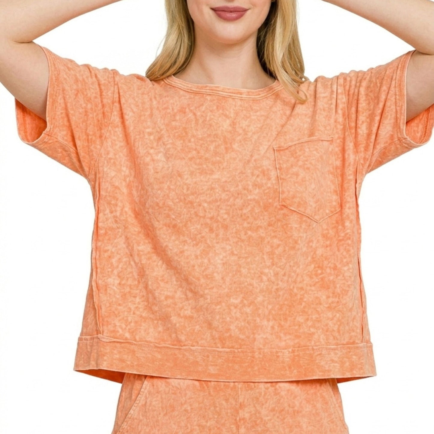 Lifestyle view of the Zenana orange boxy top and shorts set showing the relaxed boutique fit.