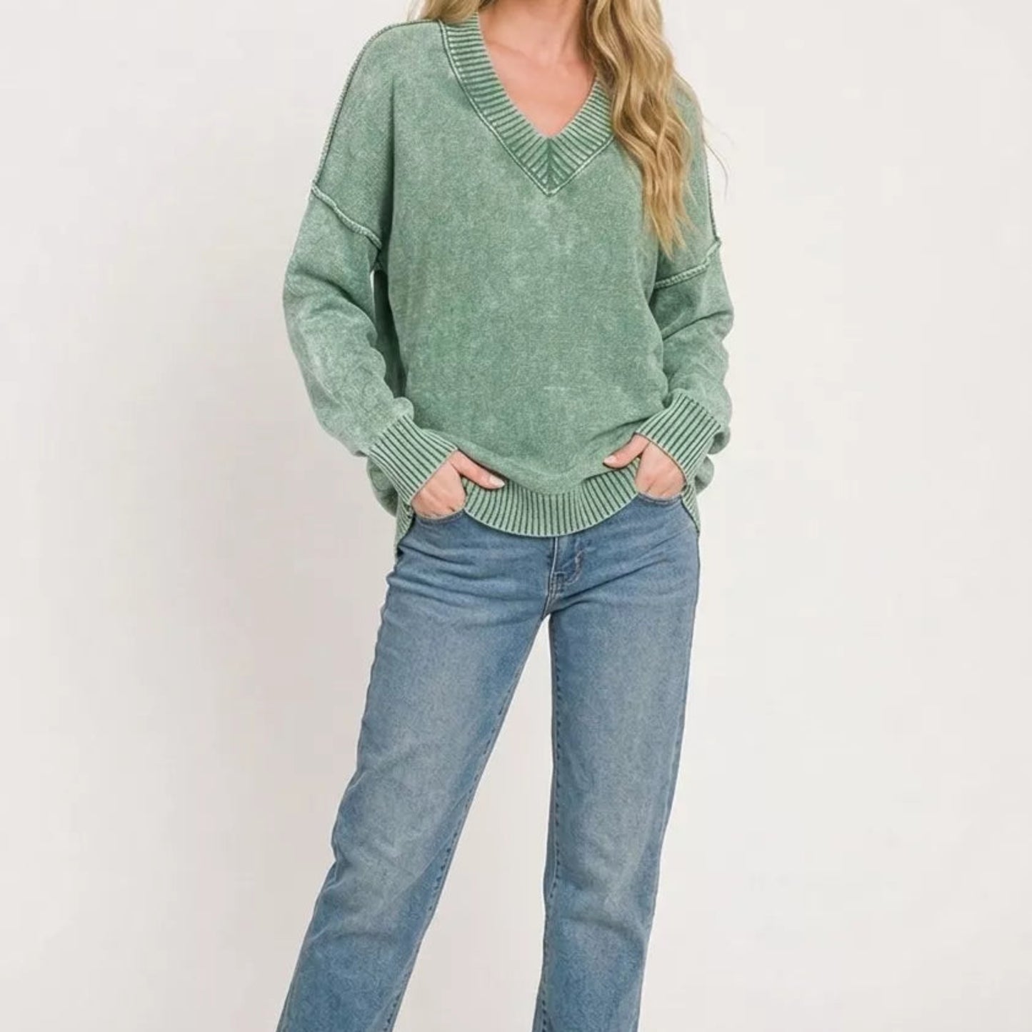 Casual slouchy streetwear outfit styling with a green oversized Zenana deep V-neck sweater from Solazura Boutique