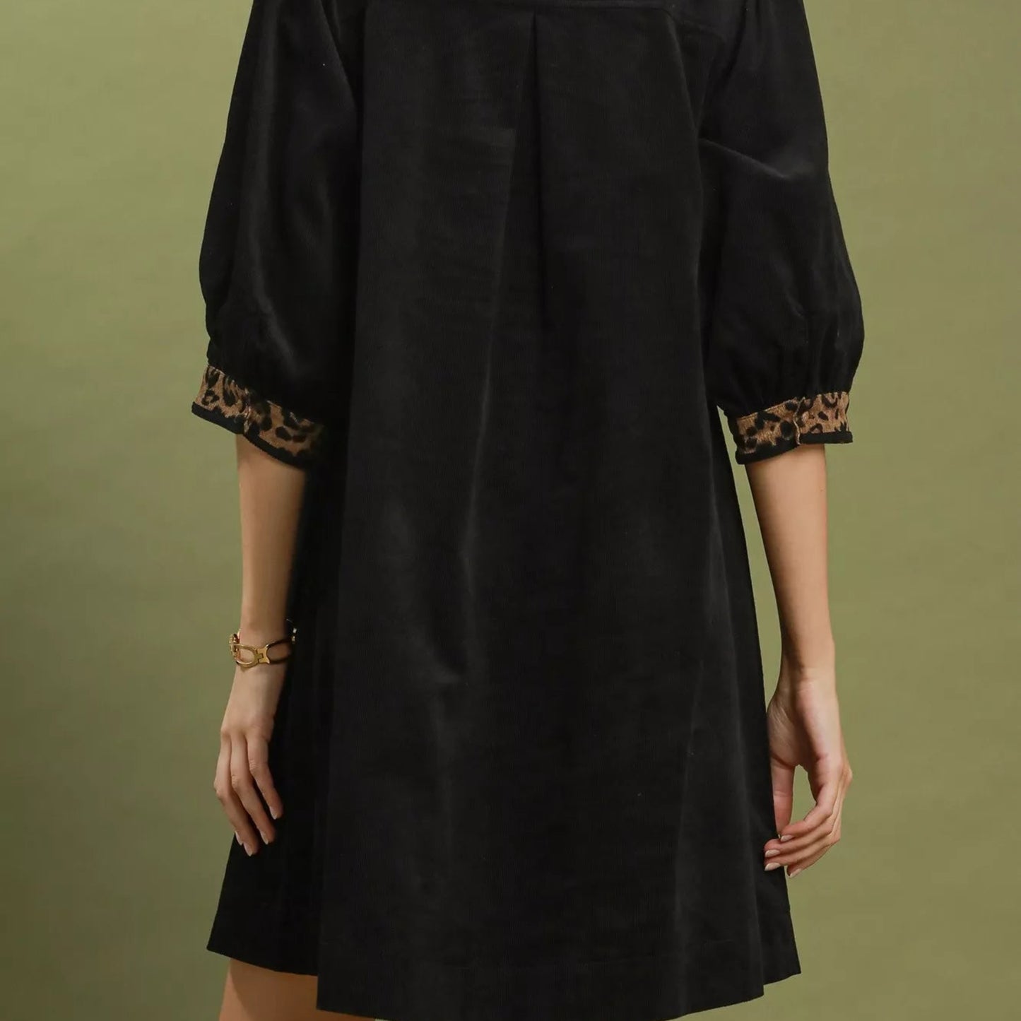 Back view of the breezy black V-neck shift dress showing rear fit from Solazura Boutique