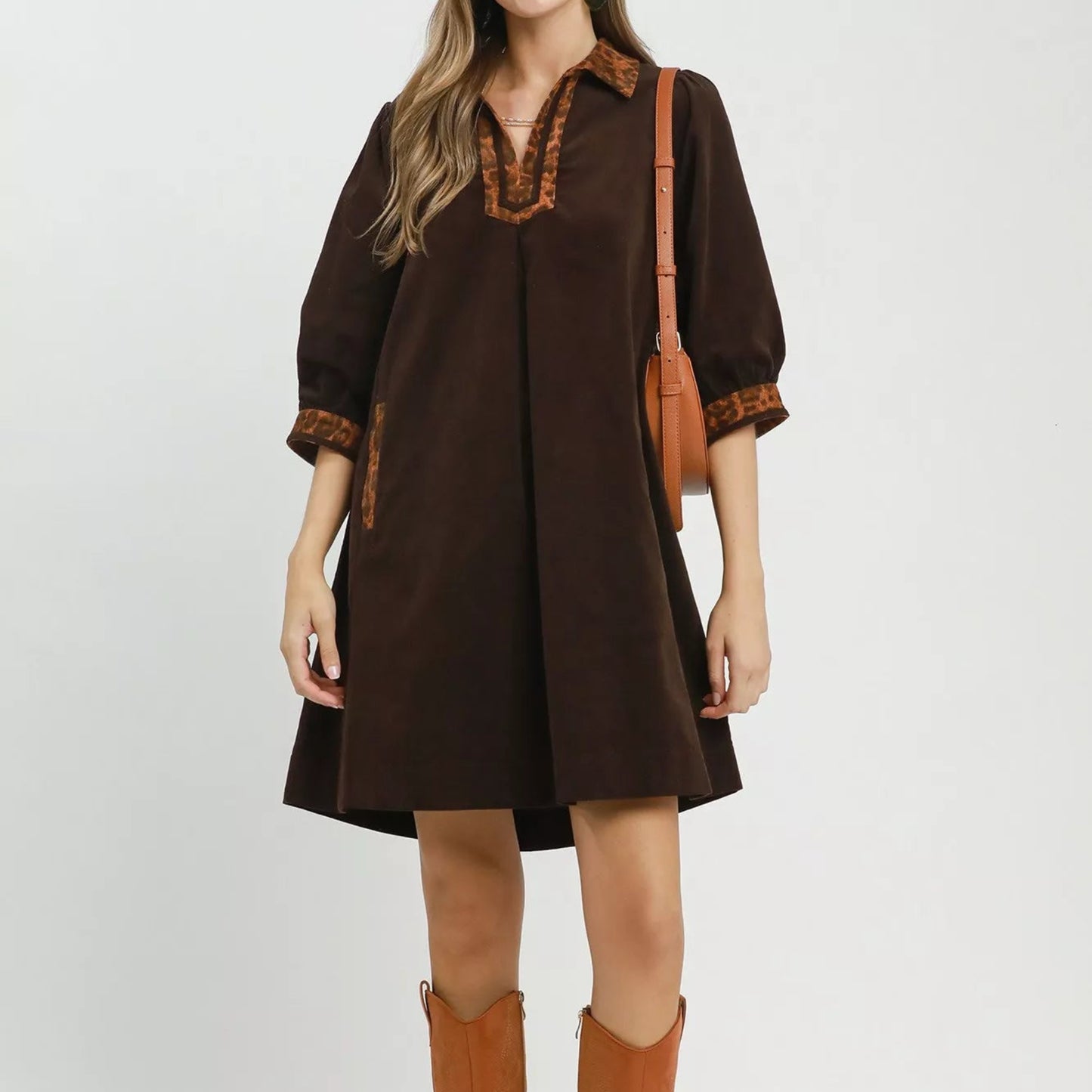 Full length of the functional side pockets on the Umgee casual shift dress from Solazura Boutique