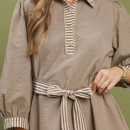 Close up shot of the elastic puff sleeve on a brown striped Umgee dress from Solazura Boutique