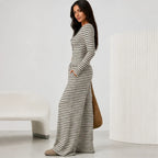 Side view of black 2 piece women's striped pants set with long sleeve cardigan and wide leg pants