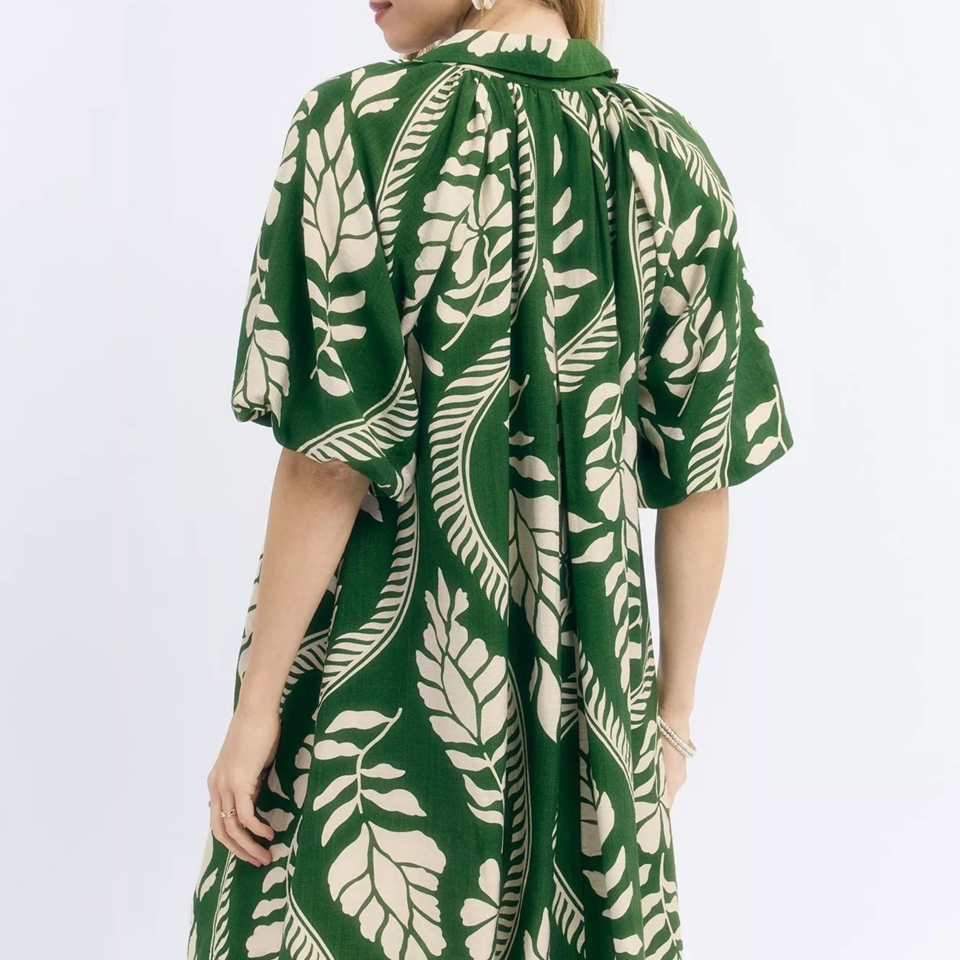 Back view of the breezy cream green Umgee leafy print mini dress showing rear fit from Solazura Boutique