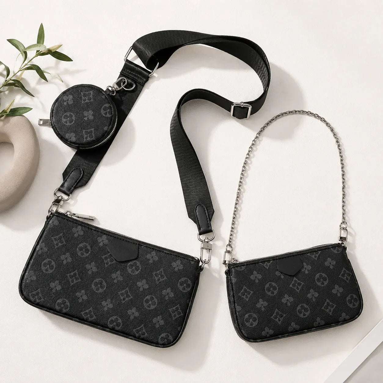 Black 3-piece convertible crossbody handbag set featuring a detachable shoulder bag, coin pouch, and adjustable crossbody strap.