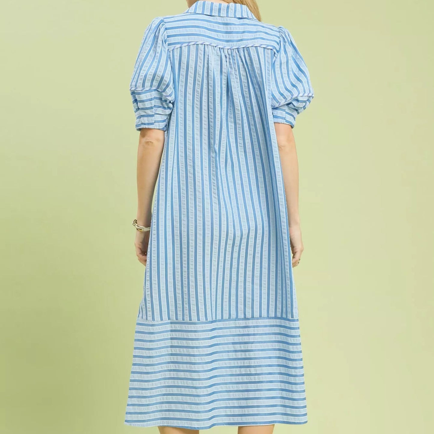 Back view of the blue striped puff sleeve midi dress showing rear fit from Solazura Boutique