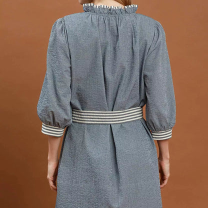 Back view of the breezy denim contrast trim mini dress showing rear fit from Solazura Boutique