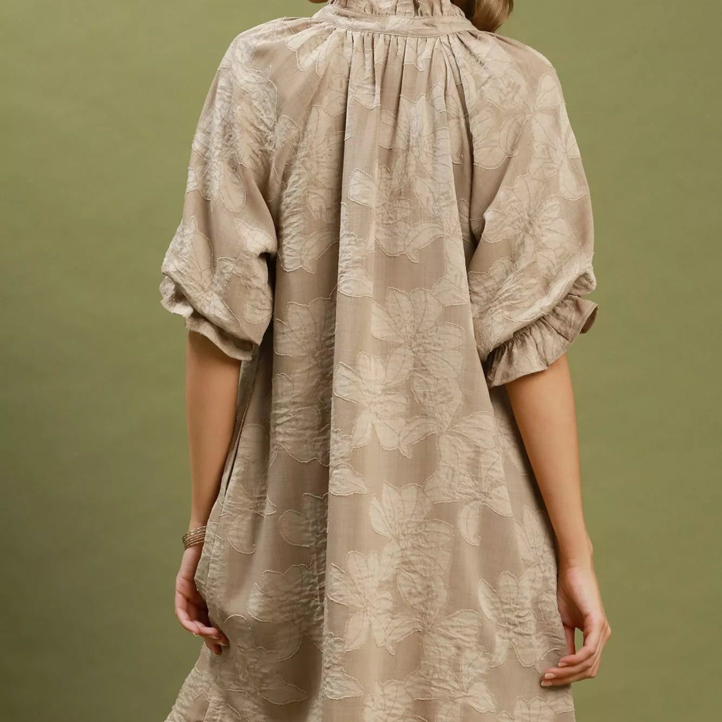 Back view of the breezy taupe floral jacquard dress showing rear bodice fit from Solazura Boutique