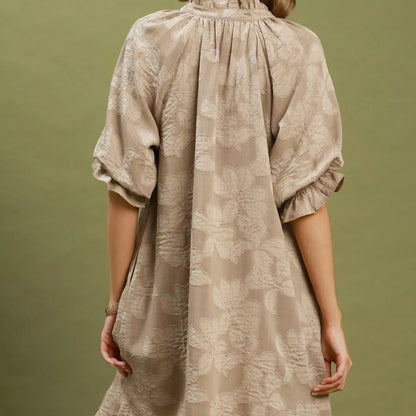 Back view of the breezy taupe floral jacquard dress showing rear bodice fit from Solazura Boutique
