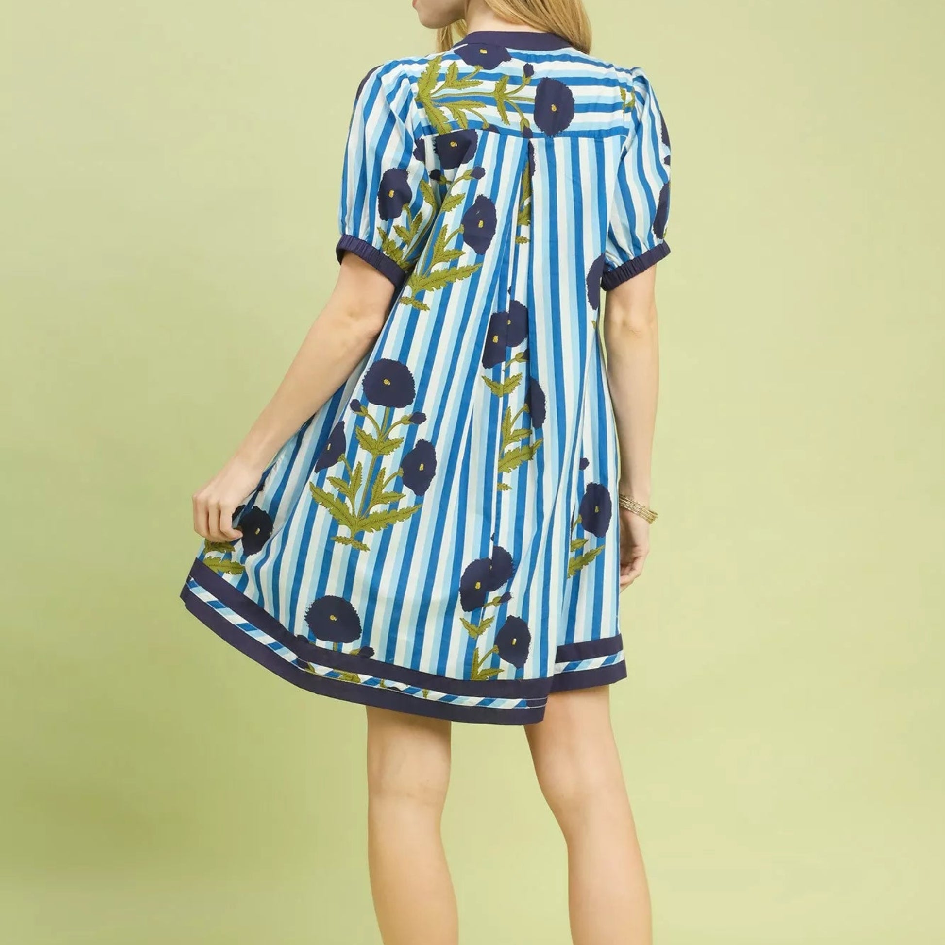 Back view of the breezy ocean blue floral print contrast dress showing rear fit from Solazura Boutique