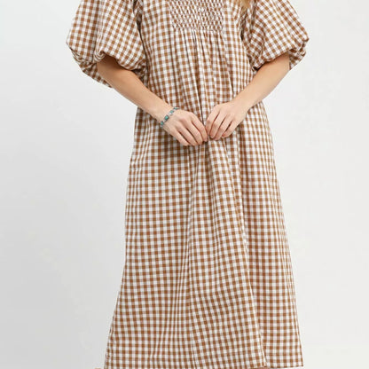 Front view of a casual brown plaid Umgee midi dress with romantic puff sleeves from Solazura Boutique