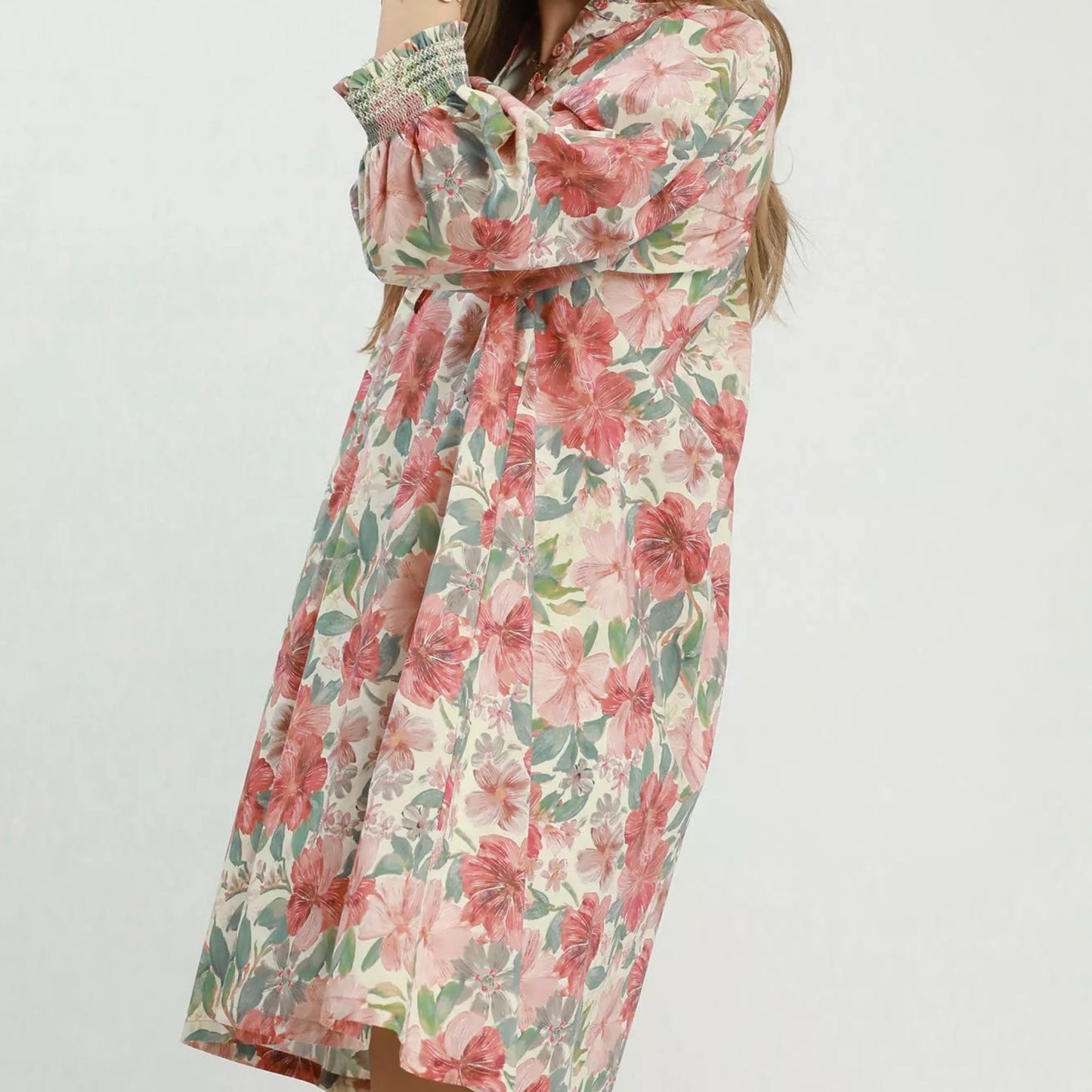 Close up detail of the stretchy smocked wrist cuffs on an Umgee mixed floral dress from Solazura Boutique