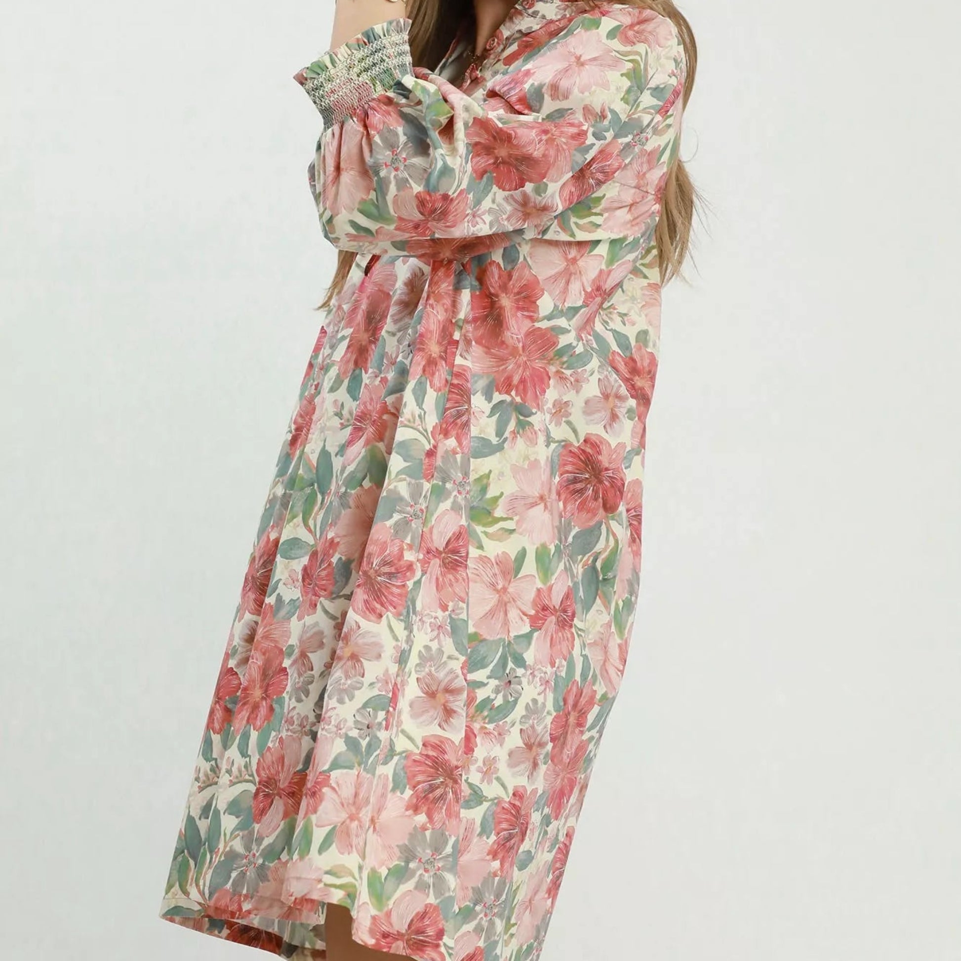Close up detail of the stretchy smocked wrist cuffs on an Umgee mixed floral dress from Solazura Boutique