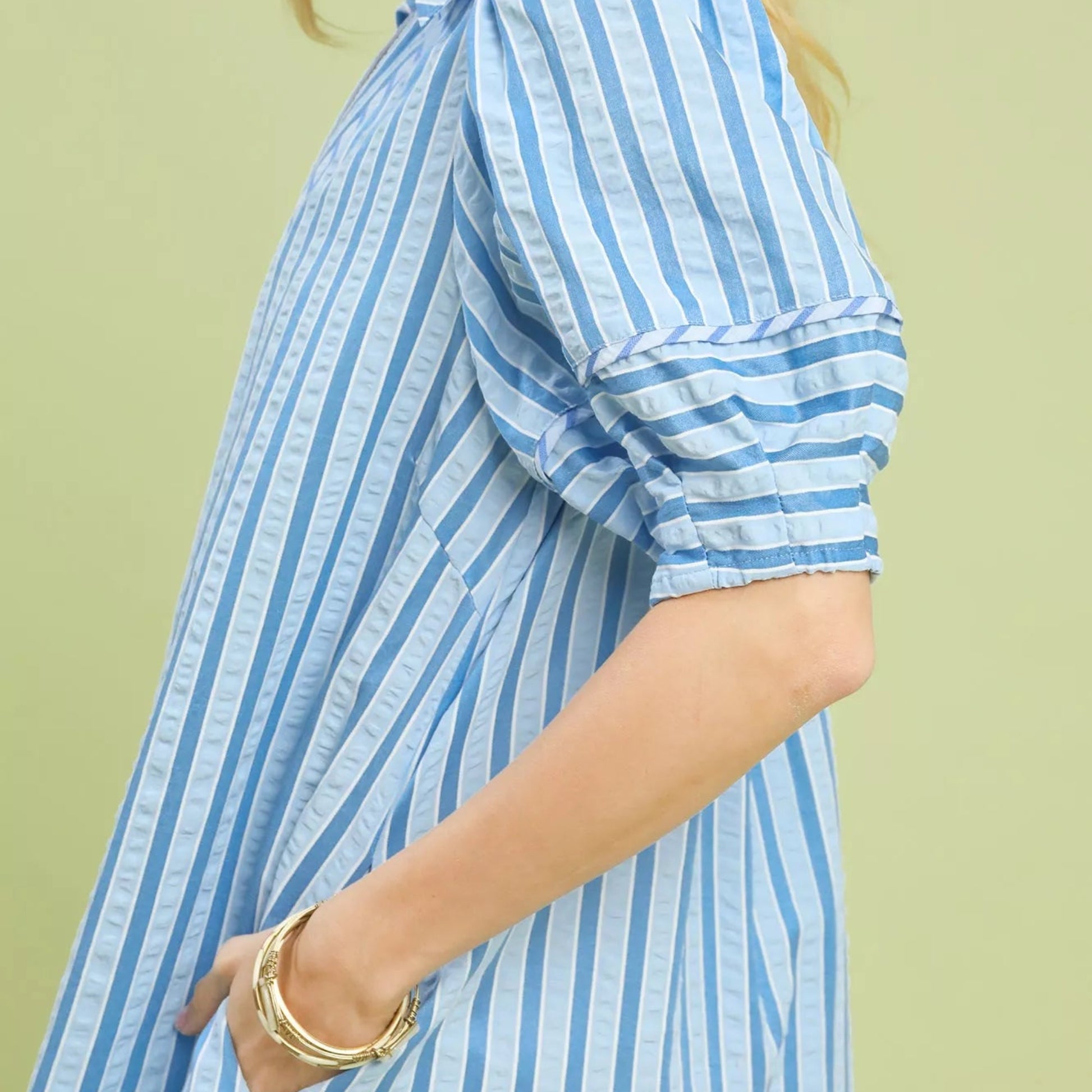 Close up detail of the romantic elastic puff sleeve on an Umgee striped dress from Solazura Boutique