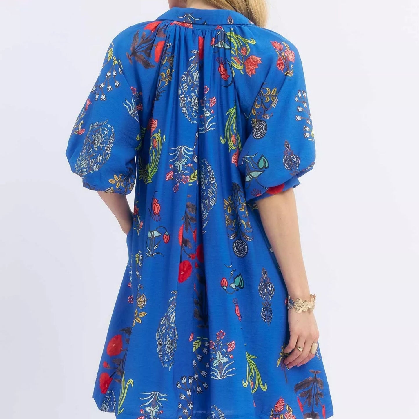 Back view of the breezy botanical floral Umgee mini dress showing rear bodice fit from Solazura Boutique