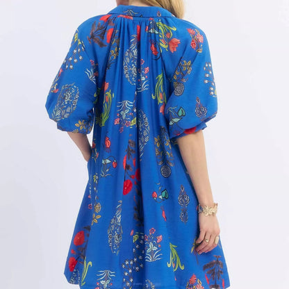 Back view of the breezy botanical floral Umgee mini dress showing rear bodice fit from Solazura Boutique