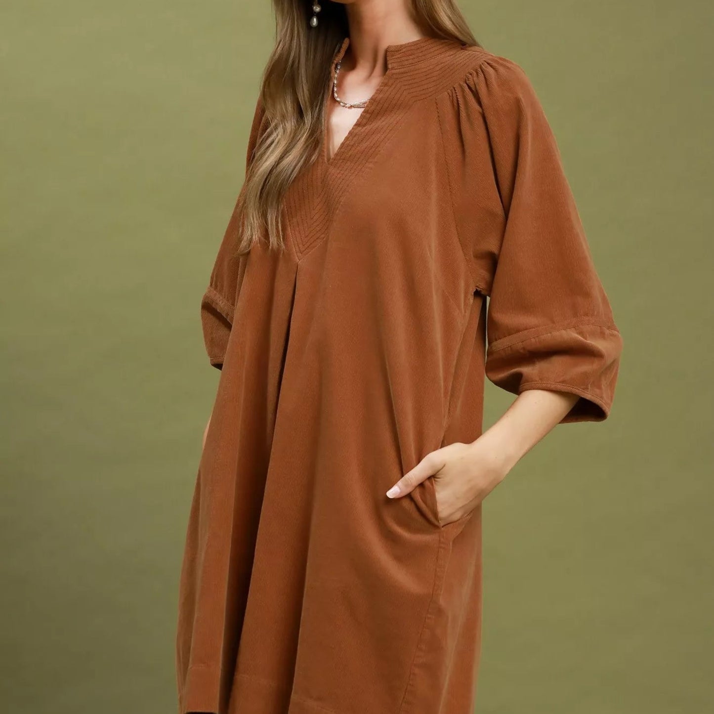 Chic autumn or transitional winter outfit styling with a camel corduroy shift dress from Solazura Boutique