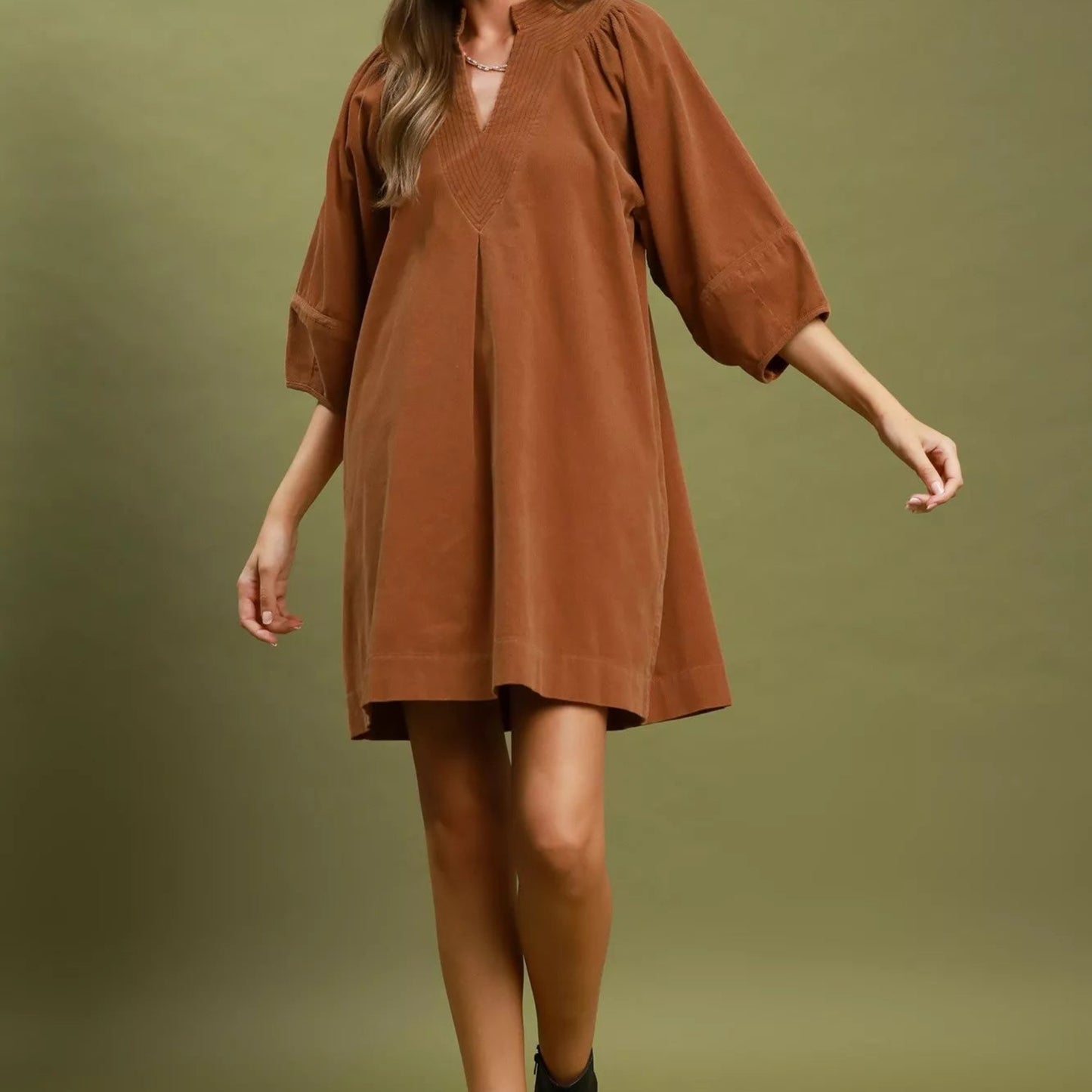 Texture shot of the premium ribbed camel corduroy fabric on an Umgee dress from Solazura Boutique