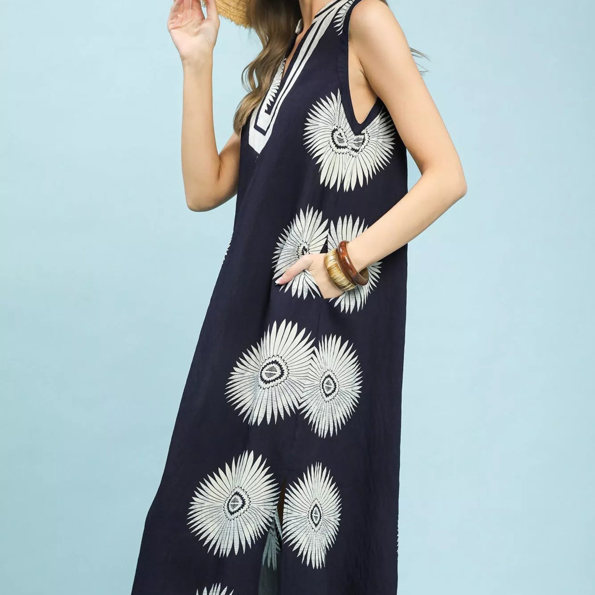 Texture shot of the premium navy geometric pattern fabric on an Umgee midi dress from Solazura Boutique