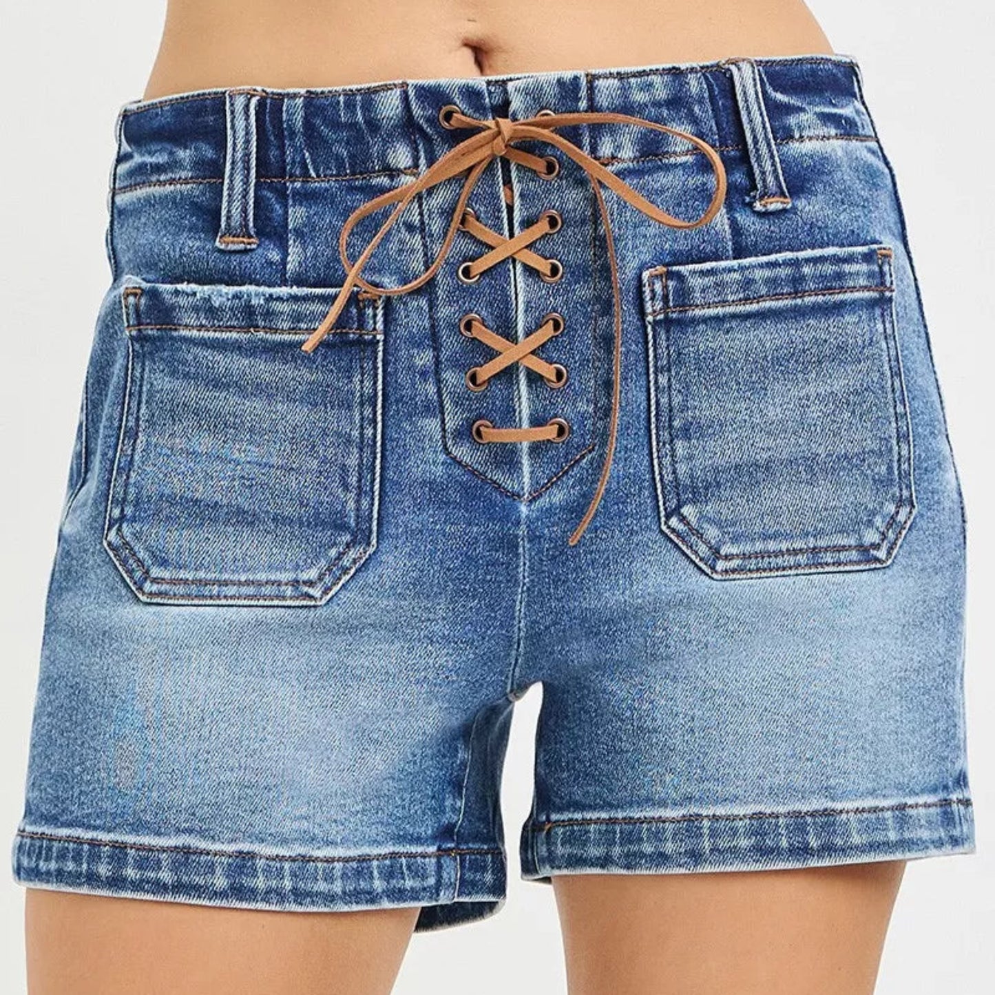 RISEN High Rise Front Tie Up Shorts with Patch Pockets in Medium Wash - Front View