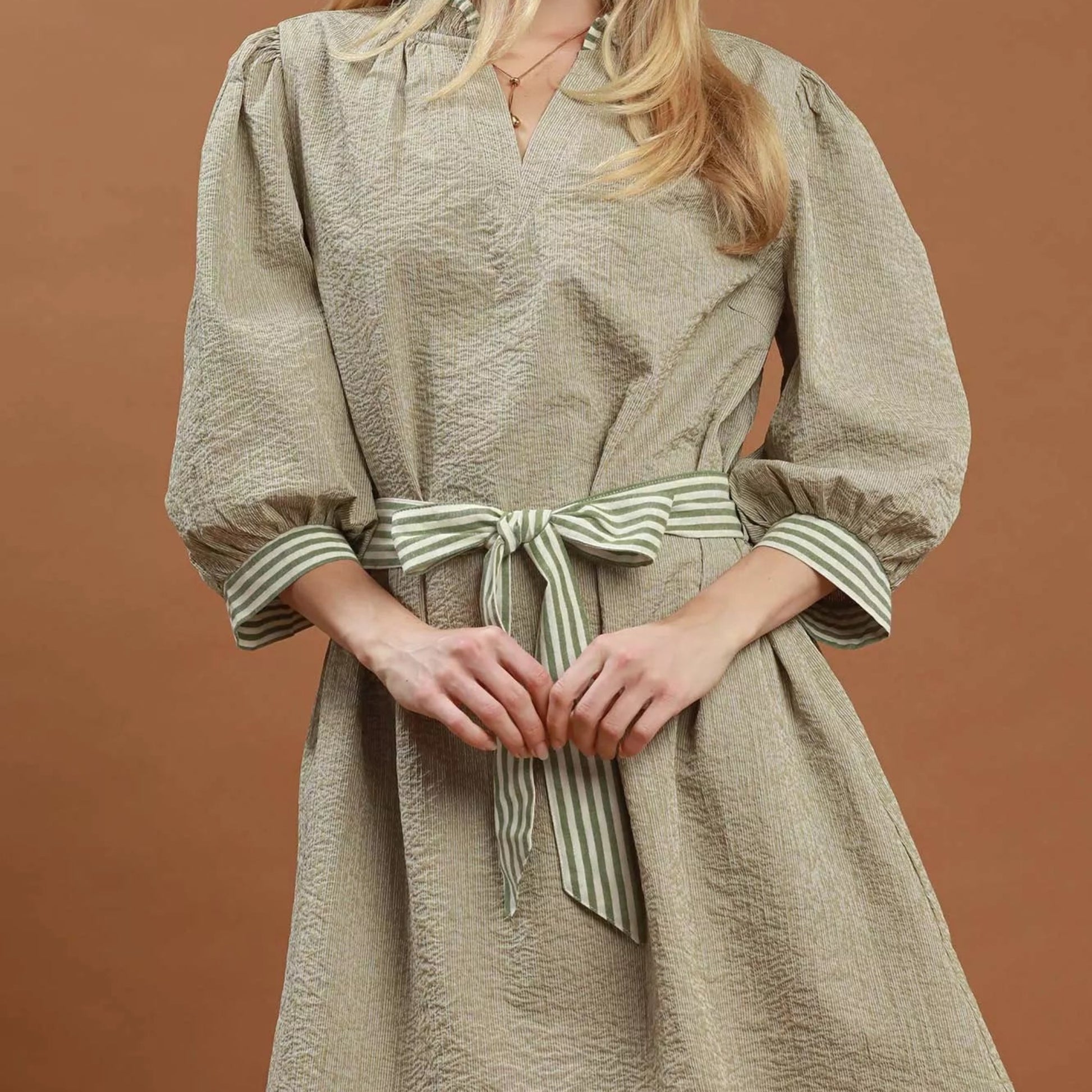 Front view of the texturized Umgee mini dress with contrast trim details from Solazura Boutique