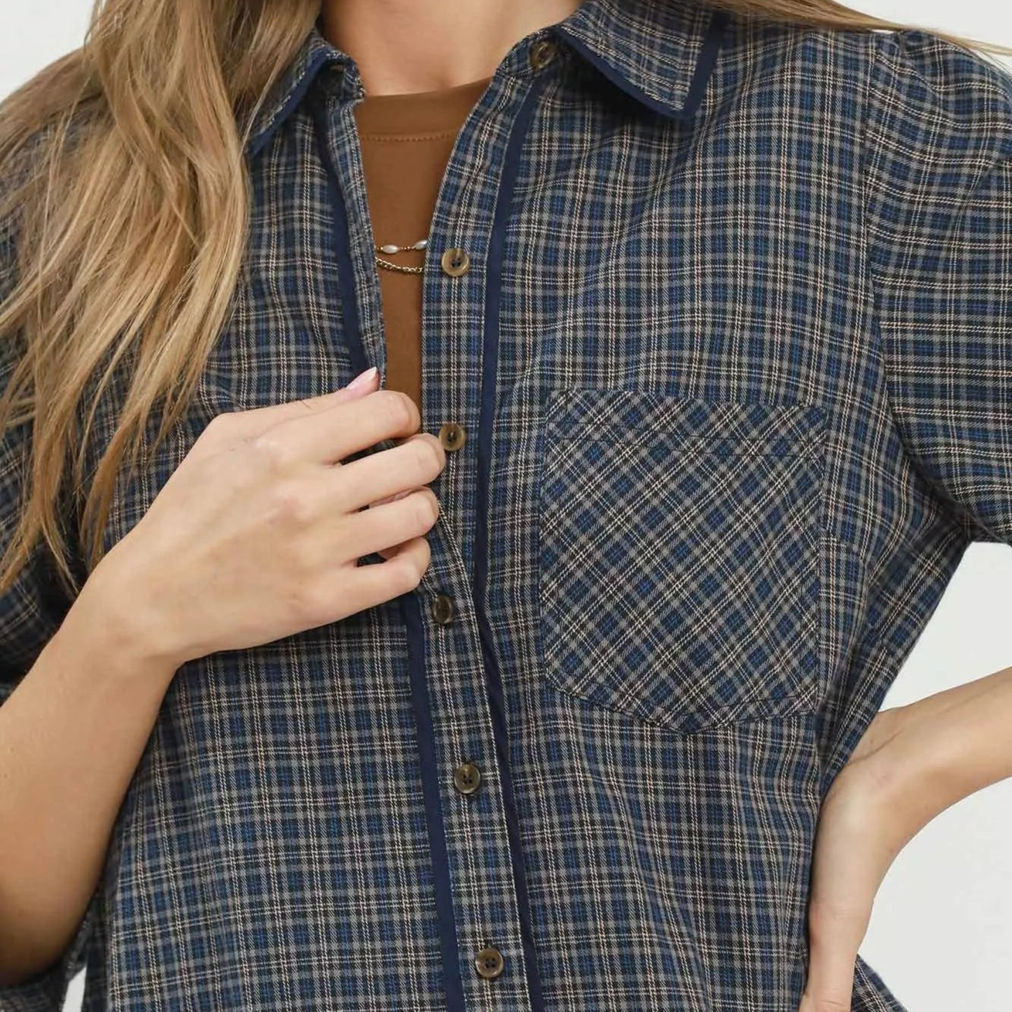 Button view of the navy plaid oversized shirt dress showing length and fit from Solazura Boutique