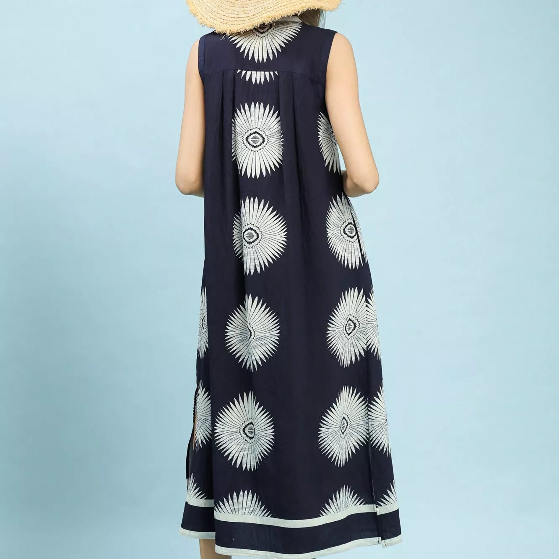 Back view of the breezy navy geometric print sleeveless midi dress showing rear fit from Solazura Boutique