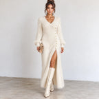 Women’s white fuzzy knit maxi dress with V-neckline, long balloon sleeves, gold button-side detail, and high side slit.