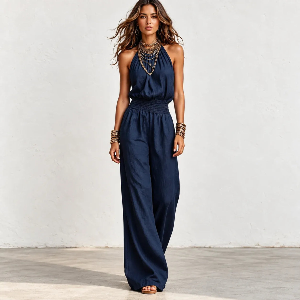 Women’s navy blue halter wide-leg linen jumpsuit with smocked waist and relaxed fit