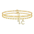 Set of gold anklets with letter 'C' charm on a white background