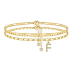 Set of gold anklets with letter 'F' charm on a white background