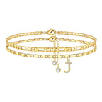 Set of gold anklets with letter 'J' charm on a white background