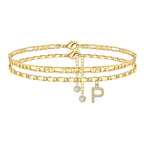 Set of gold anklets with letter 'P' charm on a white background