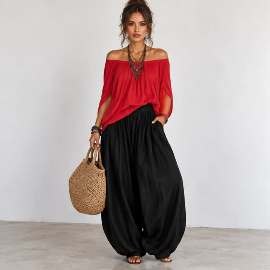 Front view of women’s red and black off-shoulder balloon pants two-piece set with wide balloon pants