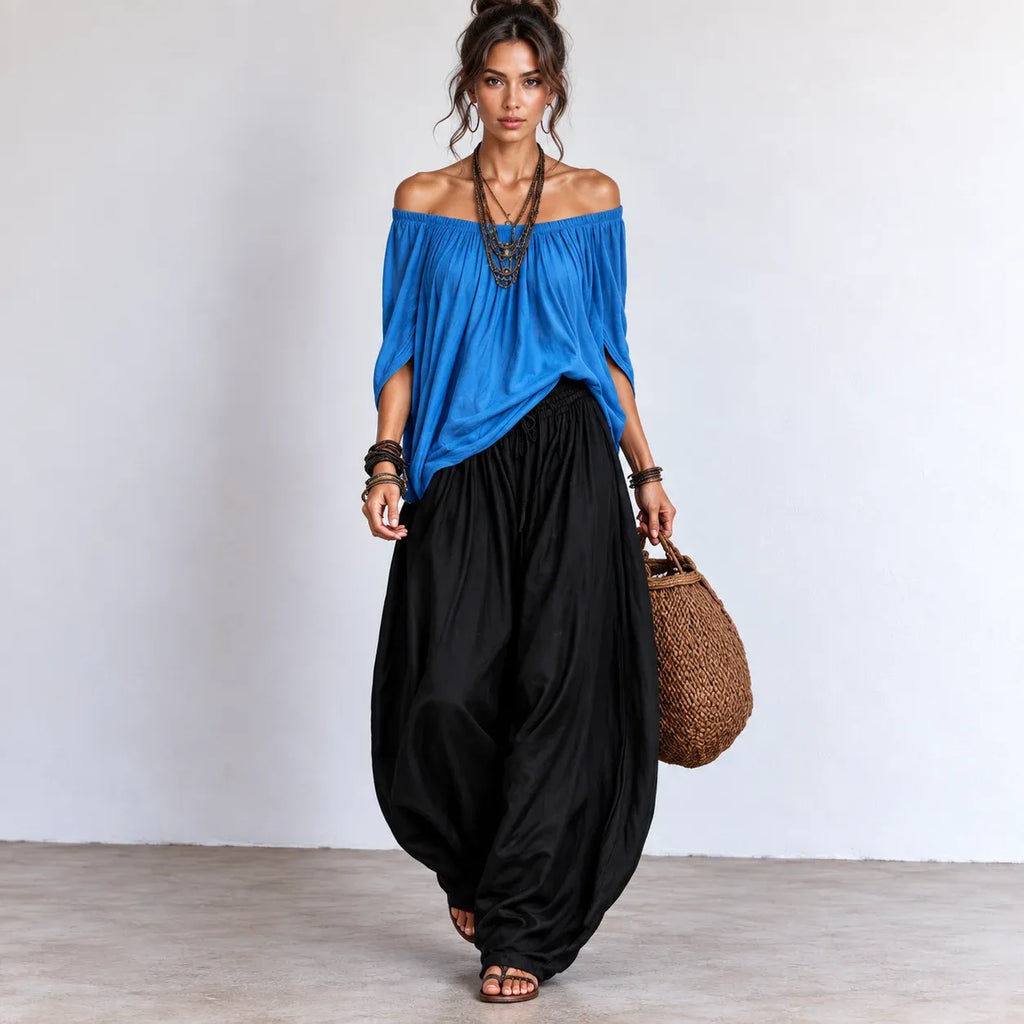 Women’s bright blue and black off-shoulder balloon pants two-piece set with flowing top and balloon-style pants