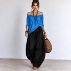 Women’s bright blue and black off-shoulder balloon pants two-piece set with flowing top and balloon-style pants