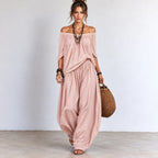 Women’s pink off-shoulder balloon pants two-piece set with matching flowing top and wide-leg pants