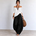 Women’s white and black off-shoulder balloon pants two-piece set with relaxed flowing top and wide-leg pants