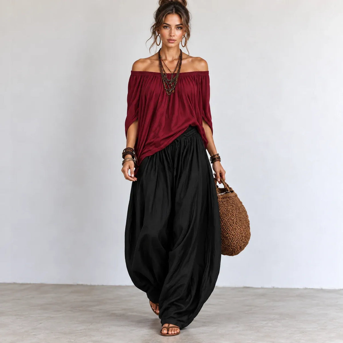 Women’s wine red and black off-shoulder balloon pants two-piece set with flowing top and wide-leg pants