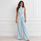 Women’s light blue sleeveless mock-neck wide-leg jumpsuit with pleated high waist and wide-leg pants