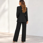 Women’s black blazer and pants two-piece suit, back view