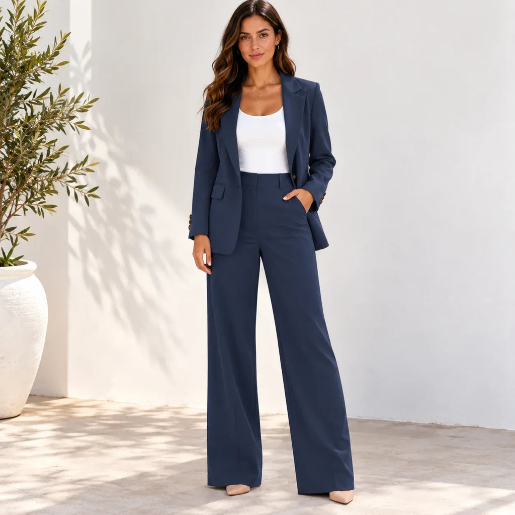 Women’s blazer and pants two-piece suit showing the side profile and wide-leg trousers