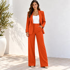Women’s orange blazer and pants two-piece suit with white top