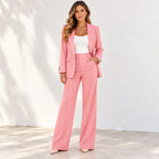 Women’s pink blazer and pants two-piece suit with white top