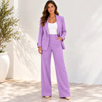 Women’s purple blazer and pants two-piece suit with white top