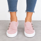Women’s pink button detail slip-on sneakers with three decorative buttons and white platform soles