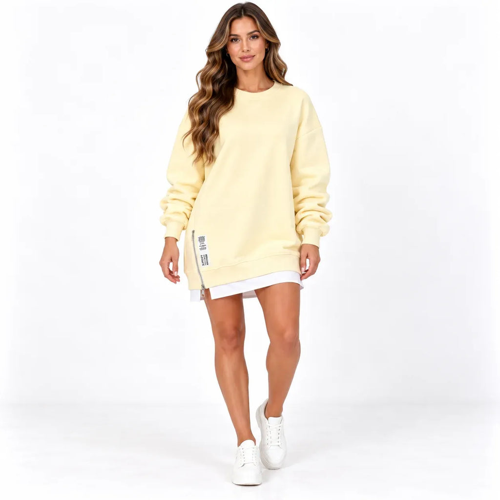 Apricot front: Model wearing an apricot long sleeve sweater dress with a round neckline and side zipper.